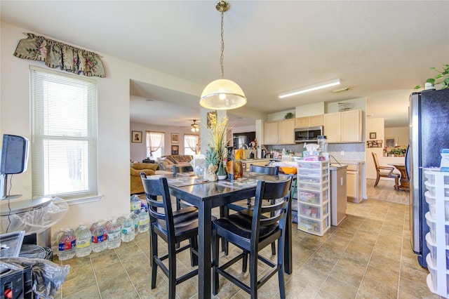 1414 Stevens Ct, Rosenberg, TX 77471 - dining space with light tile patterned flooring and ceiling fan