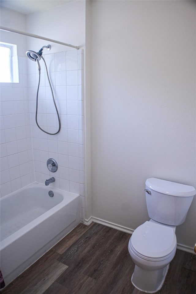 11831 Meadow Place Dr, Houston, TX 77071 - bathroom with wood finished floors, toilet,  shower combination, and baseboards