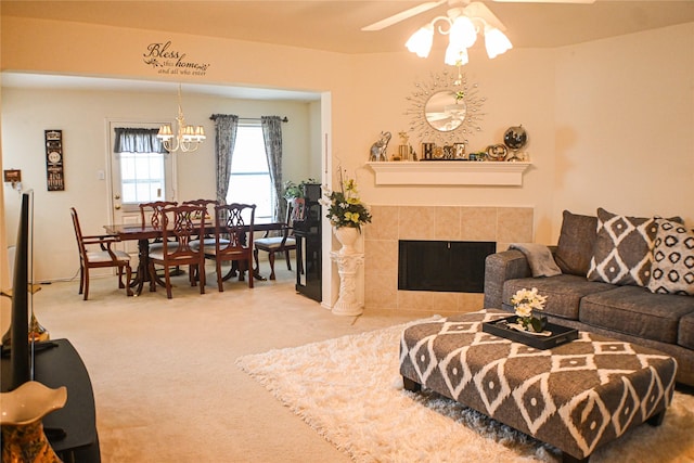11831 Meadow Place Dr, Houston, TX 77071 - living area with a chandelier, carpet floors, ceiling fan, and a tiled fireplace