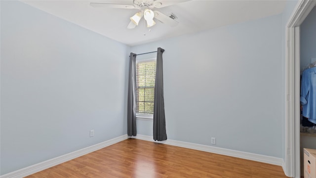 5923 W Harrow Dr, Houston, TX 77084 - empty room with ceiling fan and light wood finished floors