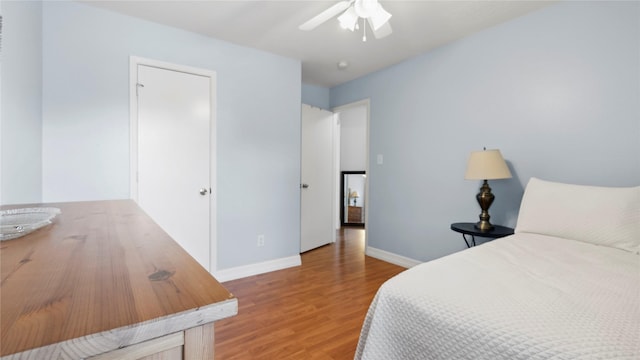 5923 W Harrow Dr, Houston, TX 77084 - bedroom with wood finished floors and ceiling fan