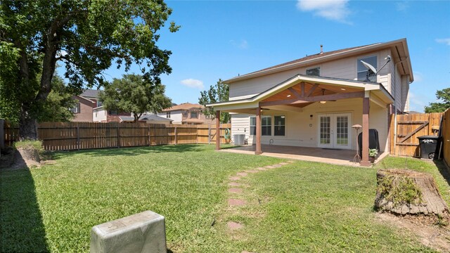 5923 W Harrow Dr, Houston, TX 77084 - rear view of house featuring french doors, a fenced backyard, and a patio area