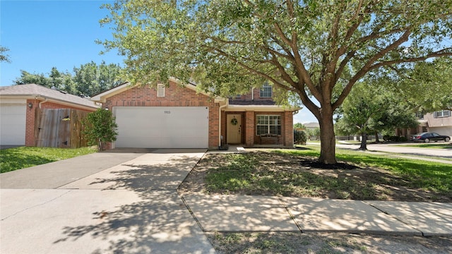 5923 W Harrow Dr, Houston, TX 77084 - view of front of property with brick siding, a garage, and driveway
