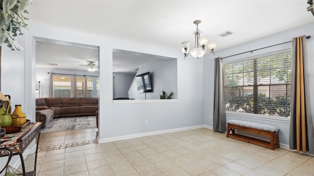 5923 W Harrow Dr, Houston, TX 77084 - unfurnished room featuring a chandelier, light tile patterned floors, plenty of natural light, and a ceiling fan
