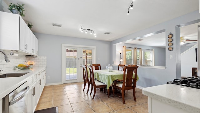 5923 W Harrow Dr, Houston, TX 77084 - dining room featuring rail lighting and light tile patterned flooring