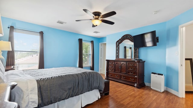 5923 W Harrow Dr, Houston, TX 77084 - bedroom with wood finished floors and ceiling fan