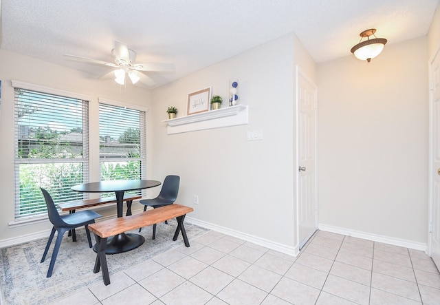 18143 Bal Harbour Dr, Houston, TX 77058 - dining room featuring healthy amount of natural light, ceiling fan, baseboards, and a textured ceiling