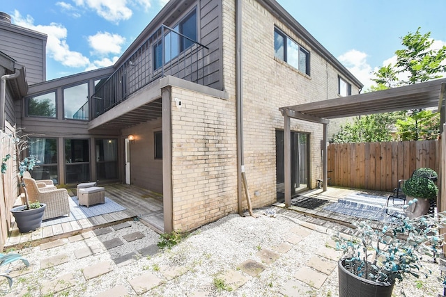 18143 Bal Harbour Dr, Houston, TX 77058 - view of property exterior featuring brick siding, a patio, and fence