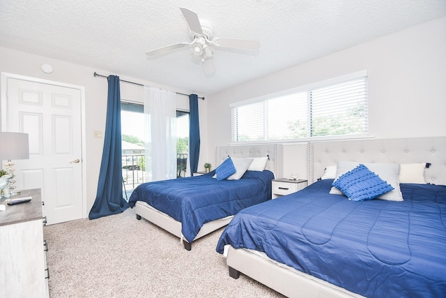 18143 Bal Harbour Dr, Houston, TX 77058 - carpeted bedroom featuring access to exterior, a textured ceiling, and a ceiling fan
