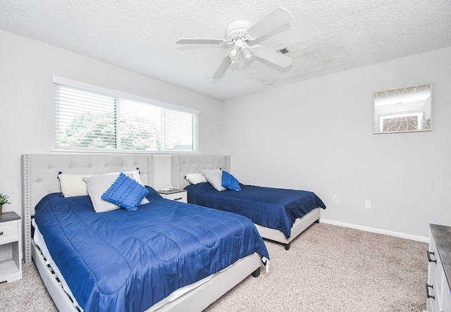 18143 Bal Harbour Dr, Houston, TX 77058 - carpeted bedroom with a textured ceiling, a ceiling fan, and baseboards