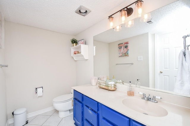 18143 Bal Harbour Dr, Houston, TX 77058 - bathroom featuring toilet, tile patterned flooring, vanity, a textured ceiling, and baseboards