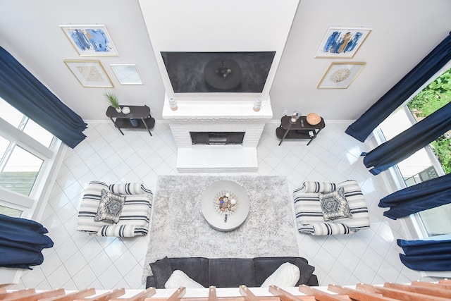 18143 Bal Harbour Dr, Houston, TX 77058 - tiled living room with tile walls and a fireplace