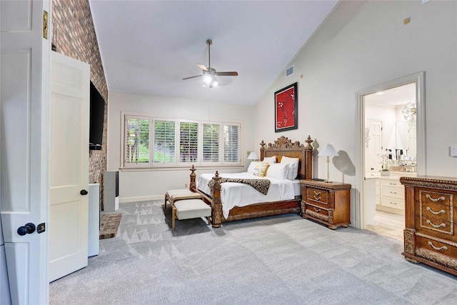 bedroom featuring light colored carpet, connected bathroom, high vaulted ceiling, ceiling fan, and baseboards
