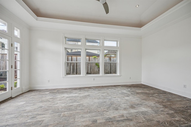 5302 Huisache St, Bellaire, TX 77401 - unfurnished room featuring crown molding, a ceiling fan, a tray ceiling, and baseboards