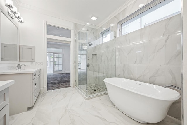 5302 Huisache St, Bellaire, TX 77401 - bathroom with ornamental molding, vanity, a shower stall, marble tiled flooring, and a freestanding tub