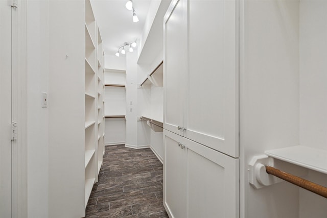 5302 Huisache St, Bellaire, TX 77401 - spacious closet featuring dark wood-style floors