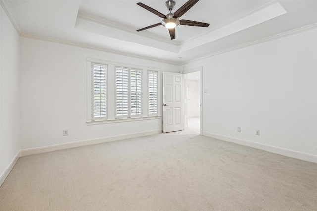5302 Huisache St, Bellaire, TX 77401 - unfurnished bedroom featuring a raised ceiling, ornamental molding, light colored carpet, baseboards, and ceiling fan