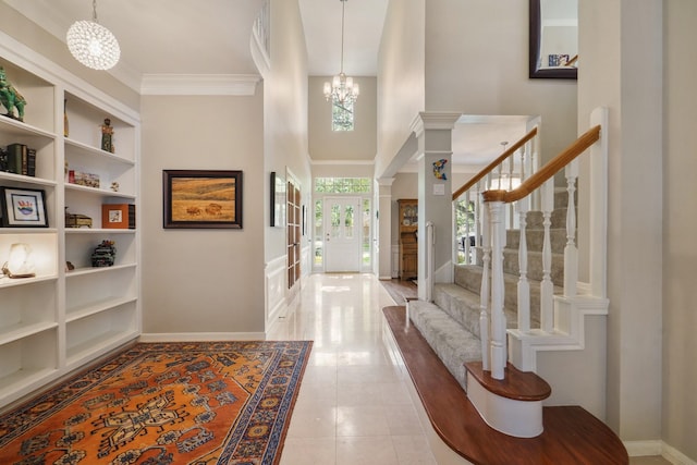 3303 Quiet Lake Dr, Katy, TX 77450 - entryway featuring a chandelier, baseboards, a towering ceiling, stairway, and french doors