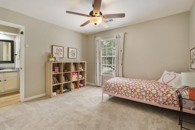 3303 Quiet Lake Dr, Katy, TX 77450 - bedroom featuring light colored carpet, a sink, baseboards, and ensuite bathroom
