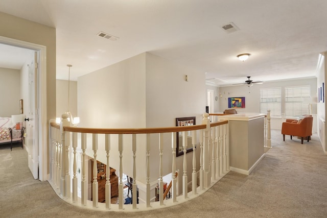 3303 Quiet Lake Dr, Katy, TX 77450 - hallway featuring an upstairs landing, light colored carpet, and baseboards