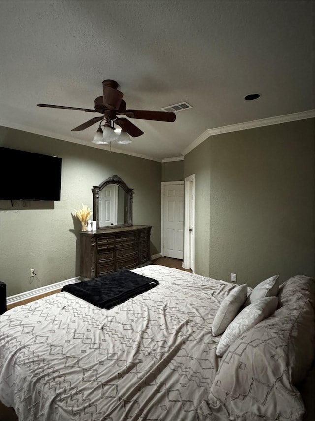 2514 Thunderbird Dr, Orange, TX 77630 - bedroom featuring ornamental molding, a ceiling fan, and a textured ceiling