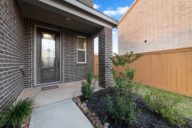 2897 Shimmer Edge Dr, Katy, TX 77493 - view of exterior entry with brick siding and fence