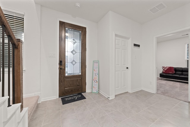 2897 Shimmer Edge Dr, Katy, TX 77493 - foyer entrance featuring baseboards and light tile patterned floors