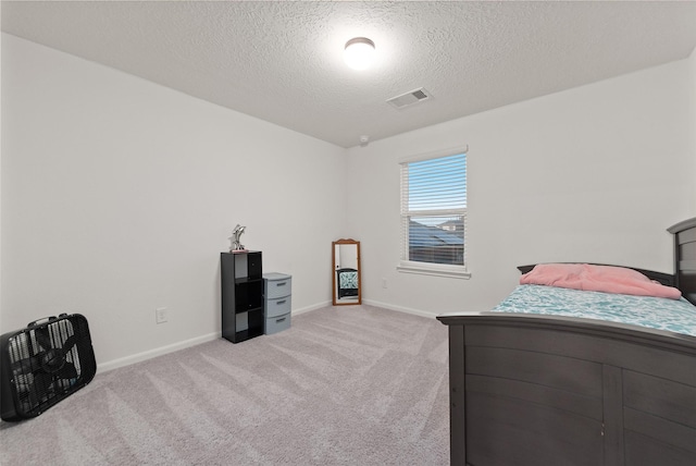 2897 Shimmer Edge Dr, Katy, TX 77493 - bedroom with a textured ceiling, light carpet, and baseboards