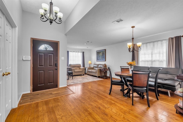 16222 Indian Cypress Dr, Cypress, TX 77429 - foyer entrance featuring a chandelier, light wood-style floors, and baseboards