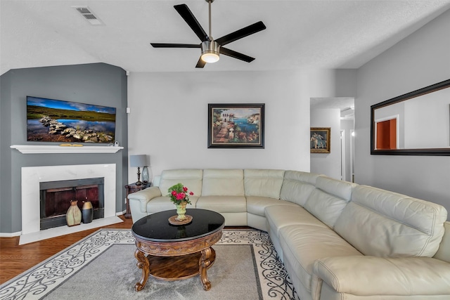 16222 Indian Cypress Dr, Cypress, TX 77429 - living area featuring ceiling fan, wood finished floors, and a fireplace