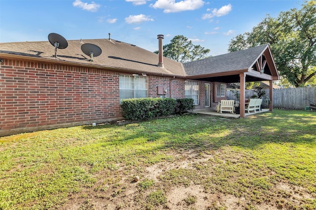 16222 Indian Cypress Dr, Cypress, TX 77429 - back of house with brick siding, a patio area, and a shingled roof