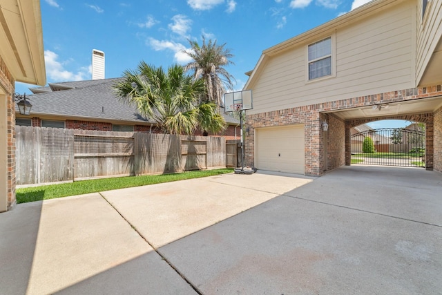 5422 Dalton Ranch Ln, Sugar Land, TX 77479 - view of home's exterior featuring brick siding, an attached garage, fence, and concrete driveway