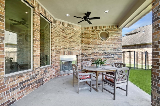 17715 Netherby Ln, Richmond, TX 77407 - view of patio featuring an outdoor brick fireplace, a ceiling fan, and outdoor dining area