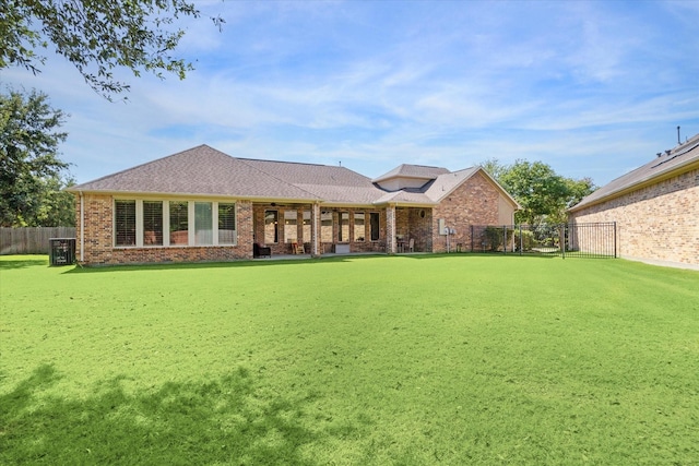 17715 Netherby Ln, Richmond, TX 77407 - back of property featuring brick siding and a fenced backyard