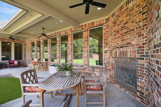 17715 Netherby Ln, Richmond, TX 77407 - view of patio with a ceiling fan and an outdoor brick fireplace