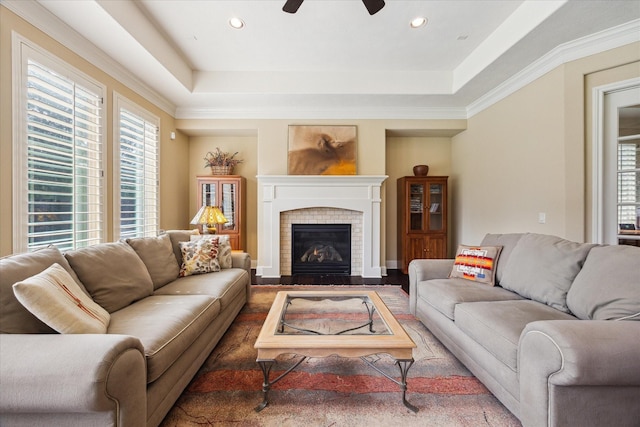 17715 Netherby Ln, Richmond, TX 77407 - living area with plenty of natural light, ceiling fan, a fireplace, a raised ceiling, and recessed lighting