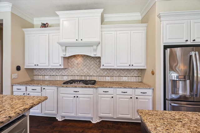 17715 Netherby Ln, Richmond, TX 77407 - kitchen featuring appliances with stainless steel finishes, backsplash, white cabinetry, and crown molding