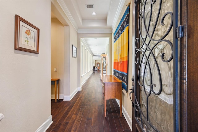 17715 Netherby Ln, Richmond, TX 77407 - hallway with baseboards, dark wood-style flooring, ornamental molding, recessed lighting, and a tray ceiling