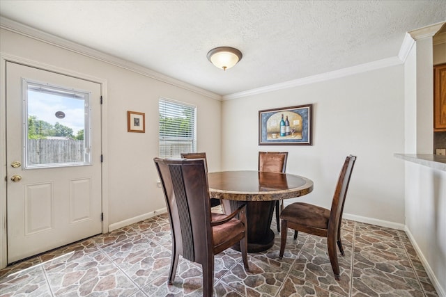 17022 Scuttle Way, Crosby, TX 77532 - dining room featuring stone floors, ornamental molding, baseboards, and a textured ceiling