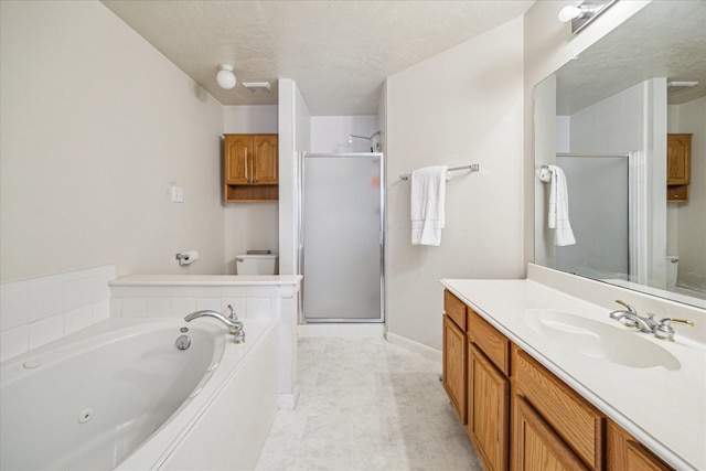 17022 Scuttle Way, Crosby, TX 77532 - full bath with a stall shower, vanity, a jetted tub, toilet, and a textured ceiling