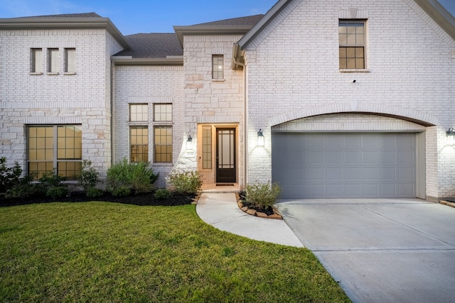 3306 Willow Fin Way, Richmond, TX 77406 - french country home featuring driveway, a front lawn, brick siding, an attached garage, and roof with shingles