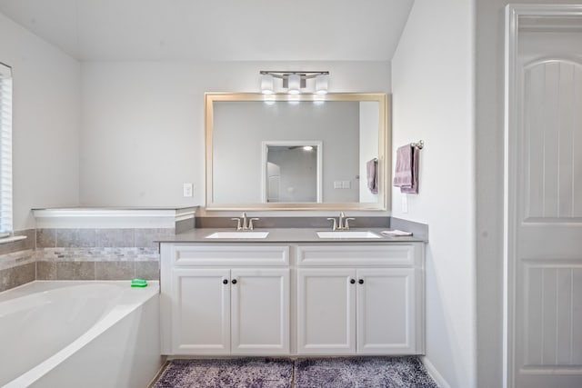 5030 Royal Amber Ln, Katy, TX 77493 - bathroom with a garden tub and double vanity