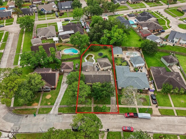 10218 Sagerock Dr, Houston, TX 77089 - aerial perspective of suburban area with a pool area and property parcel outlined