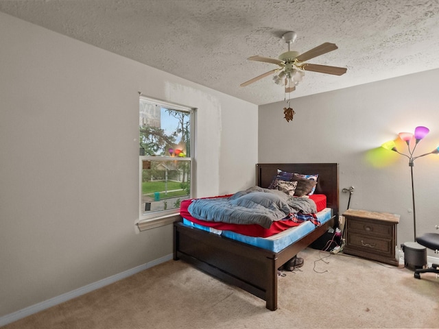 10218 Sagerock Dr, Houston, TX 77089 - carpeted bedroom featuring a textured ceiling, ceiling fan, and baseboards