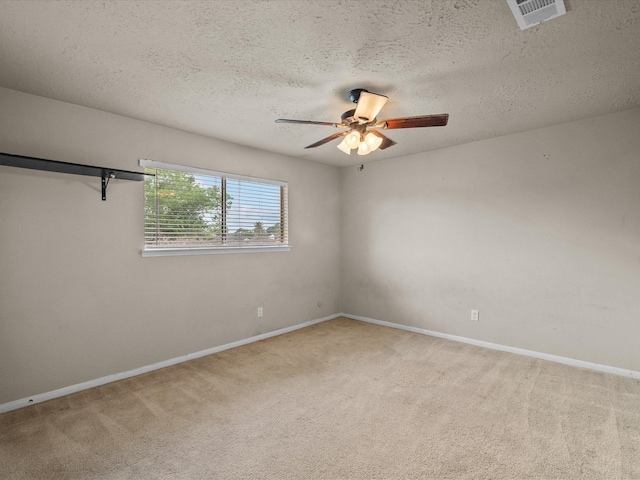 10218 Sagerock Dr, Houston, TX 77089 - spare room featuring carpet, a ceiling fan, baseboards, and a textured ceiling