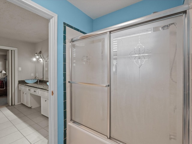 10218 Sagerock Dr, Houston, TX 77089 - full bath with tile patterned floors, vanity, and enclosed tub / shower combo