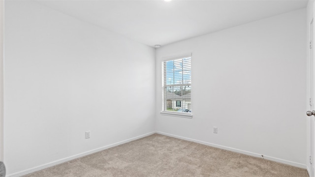 321 Lippizan Dr, Alvin, TX 77511 - unfurnished room with light colored carpet and baseboards