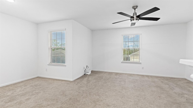321 Lippizan Dr, Alvin, TX 77511 - carpeted spare room with healthy amount of natural light, baseboards, and a ceiling fan