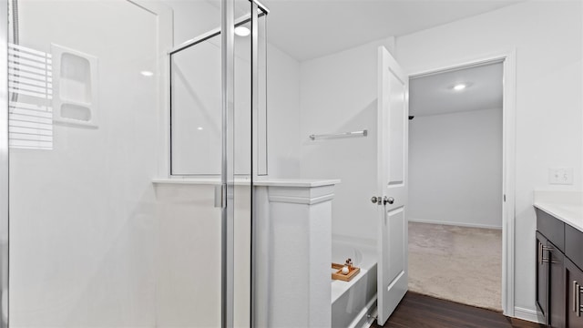 321 Lippizan Dr, Alvin, TX 77511 - full bathroom featuring a stall shower, vanity, and wood finished floors