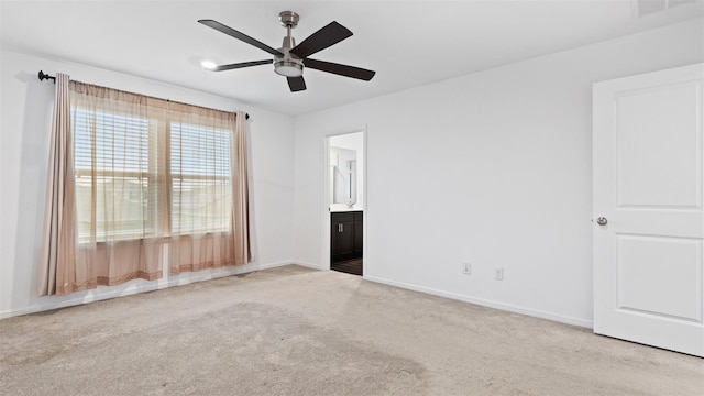 321 Lippizan Dr, Alvin, TX 77511 - unfurnished bedroom featuring carpet flooring, baseboards, connected bathroom, and a ceiling fan